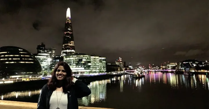 The Thames at night, the city skyline glittering across the water.